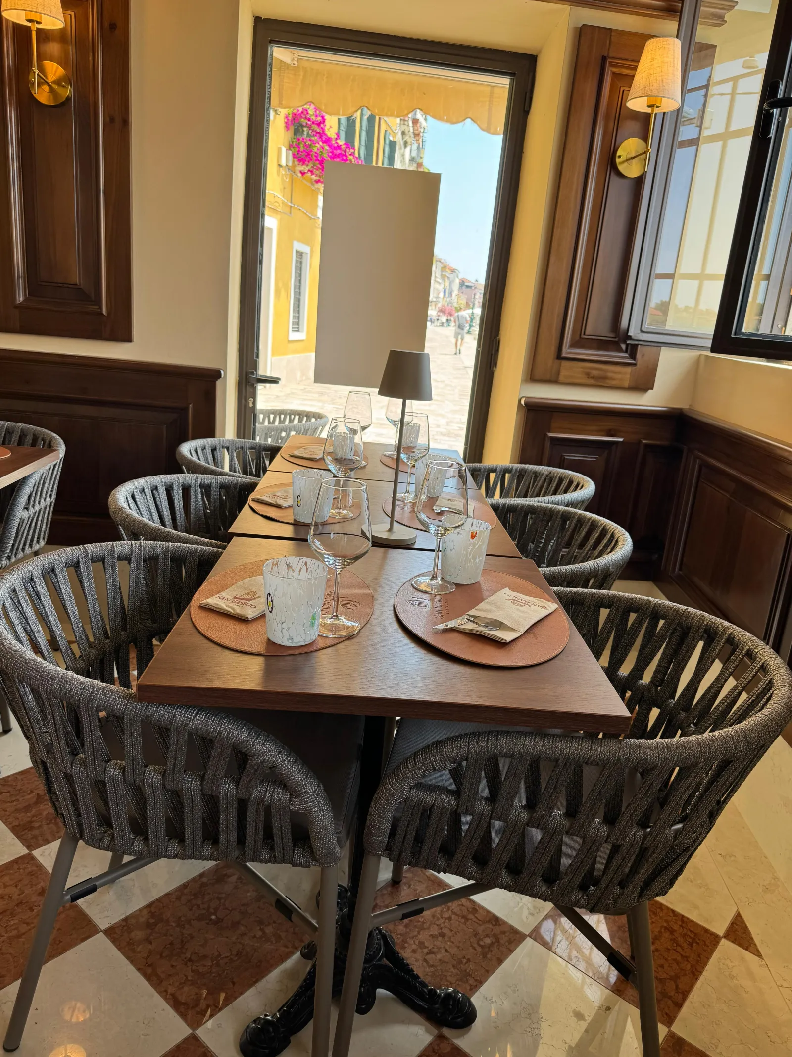 Corner table by the window in the dining room of Trattoria San Basilio