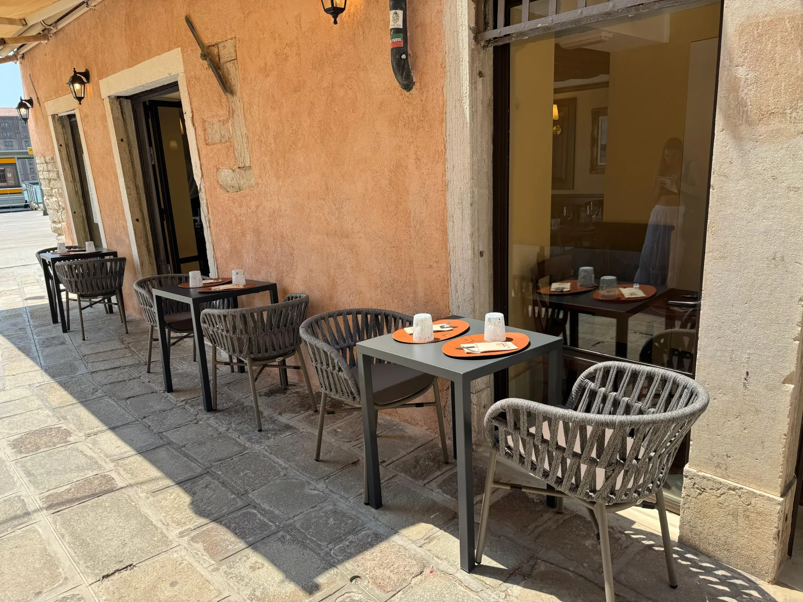 Waterfront terrace of Trattoria San Basilio looking over the lagoon and the Mulino Stucky